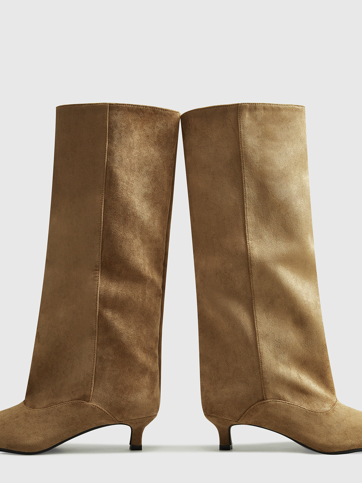 Brown suede knee-high boots angled view