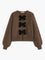 Cardigan brown with black velvet bows front view plain background
