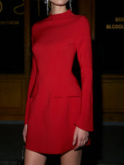 Red high-neck dress with pockets close-up detail