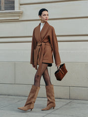 Brown suede knee-high boots with brown coat and bag, full body view