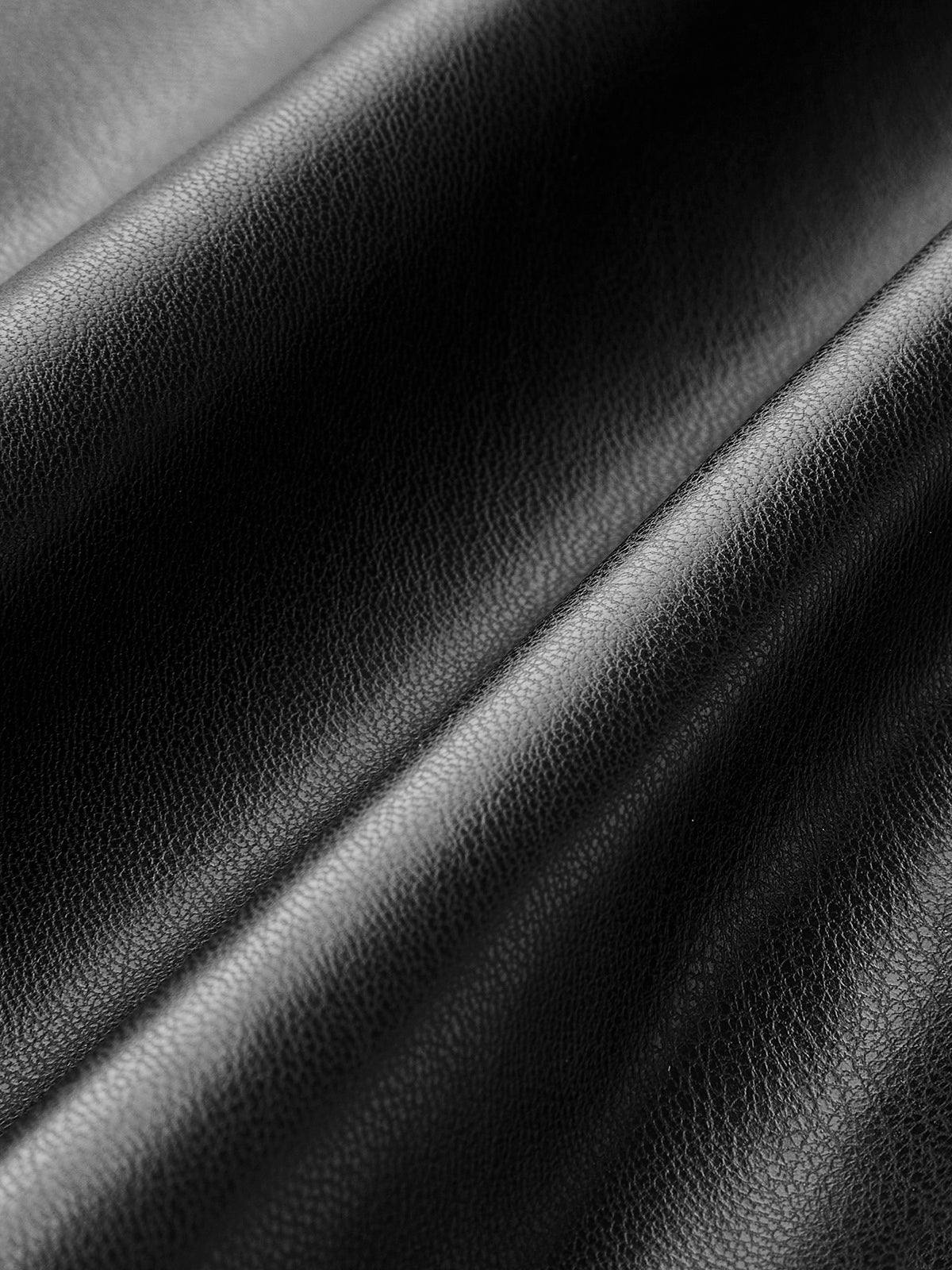 Leren plissé rok zwart textuur detail
