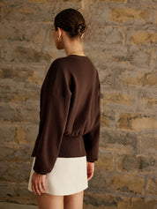 Brown cardigan with gold button back view