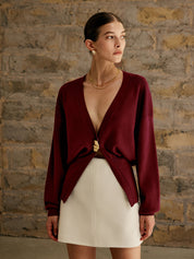 Maroon cardigan with gold button front view
