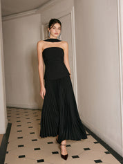 Black strapless evening dress with pleated skirt full body view