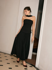 Black strapless evening dress with pleated skirt side profile view