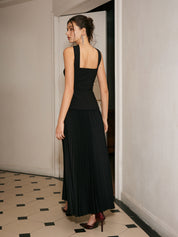 Black strapless evening dress with pleated skirt back view