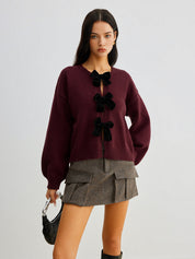 Cardigan burgundy with black velvet bows front view with skirt
