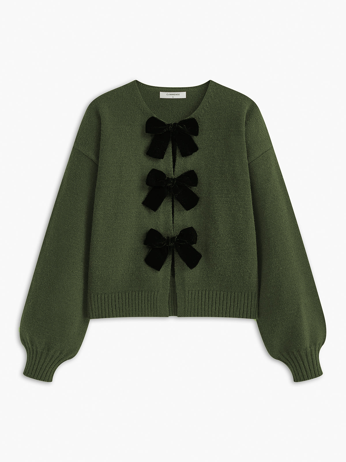 Cardigan green with black velvet bows front view plain background