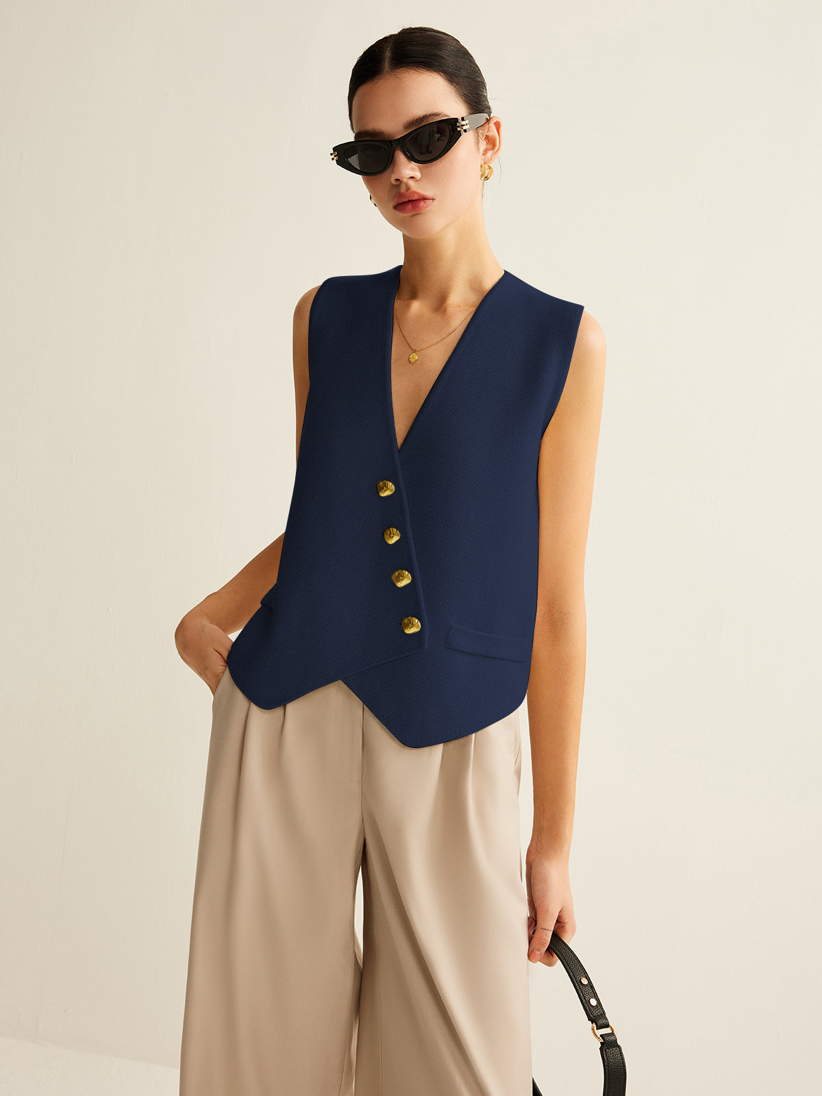 Navy vest with gold buttons front view