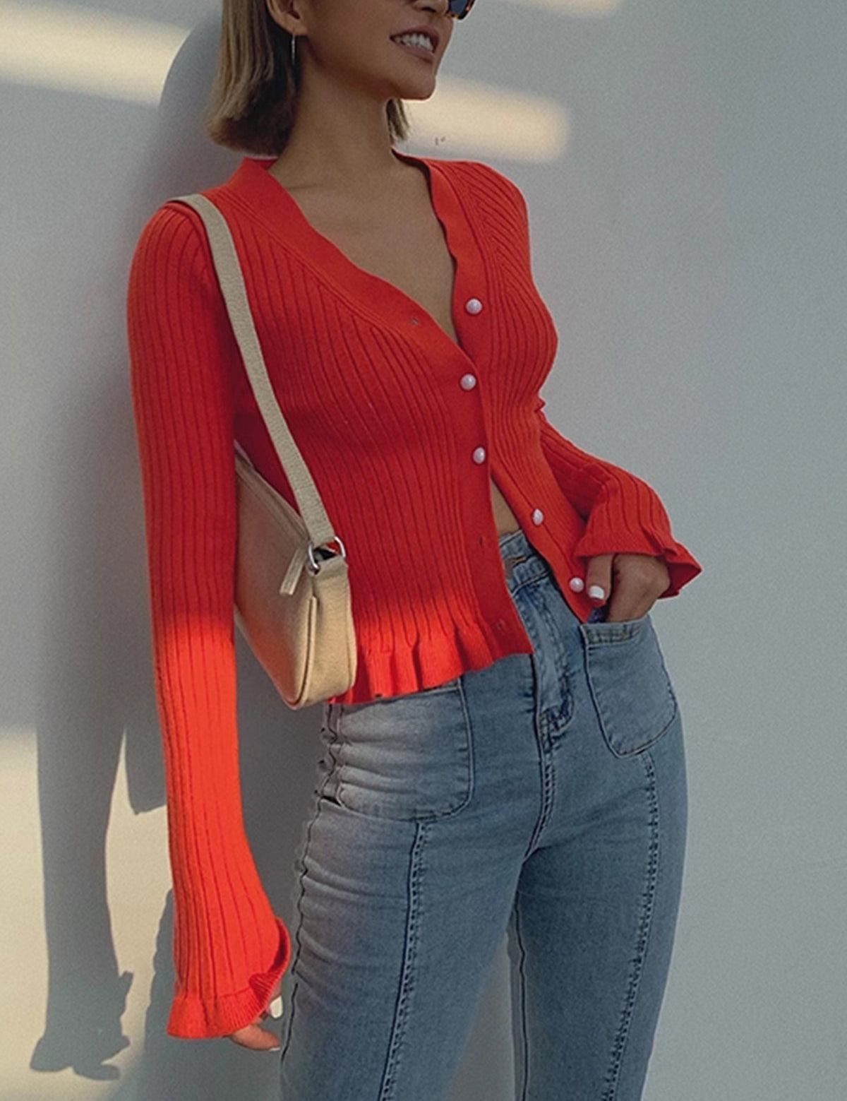 Red ribbed cardigan with white buttons side view
