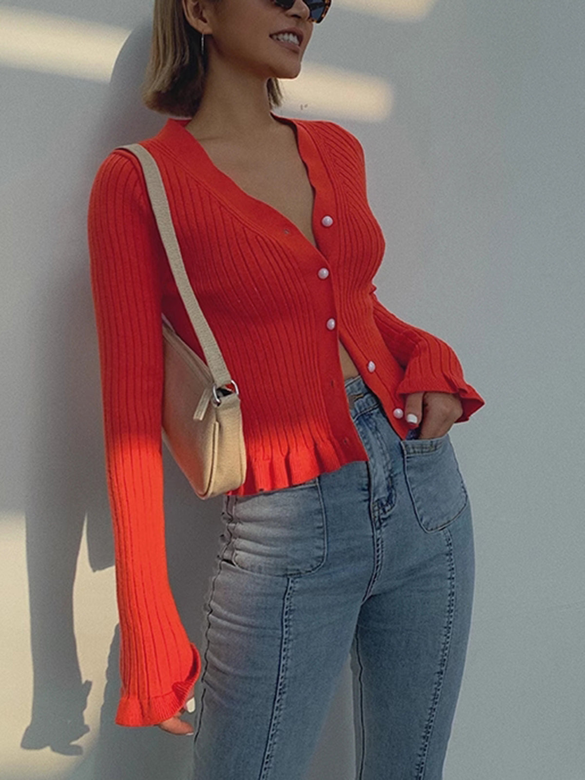 Red ribbed cardigan with white buttons side view