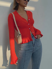 Red ribbed cardigan with white buttons side view