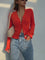 Red ribbed cardigan with white buttons front view
