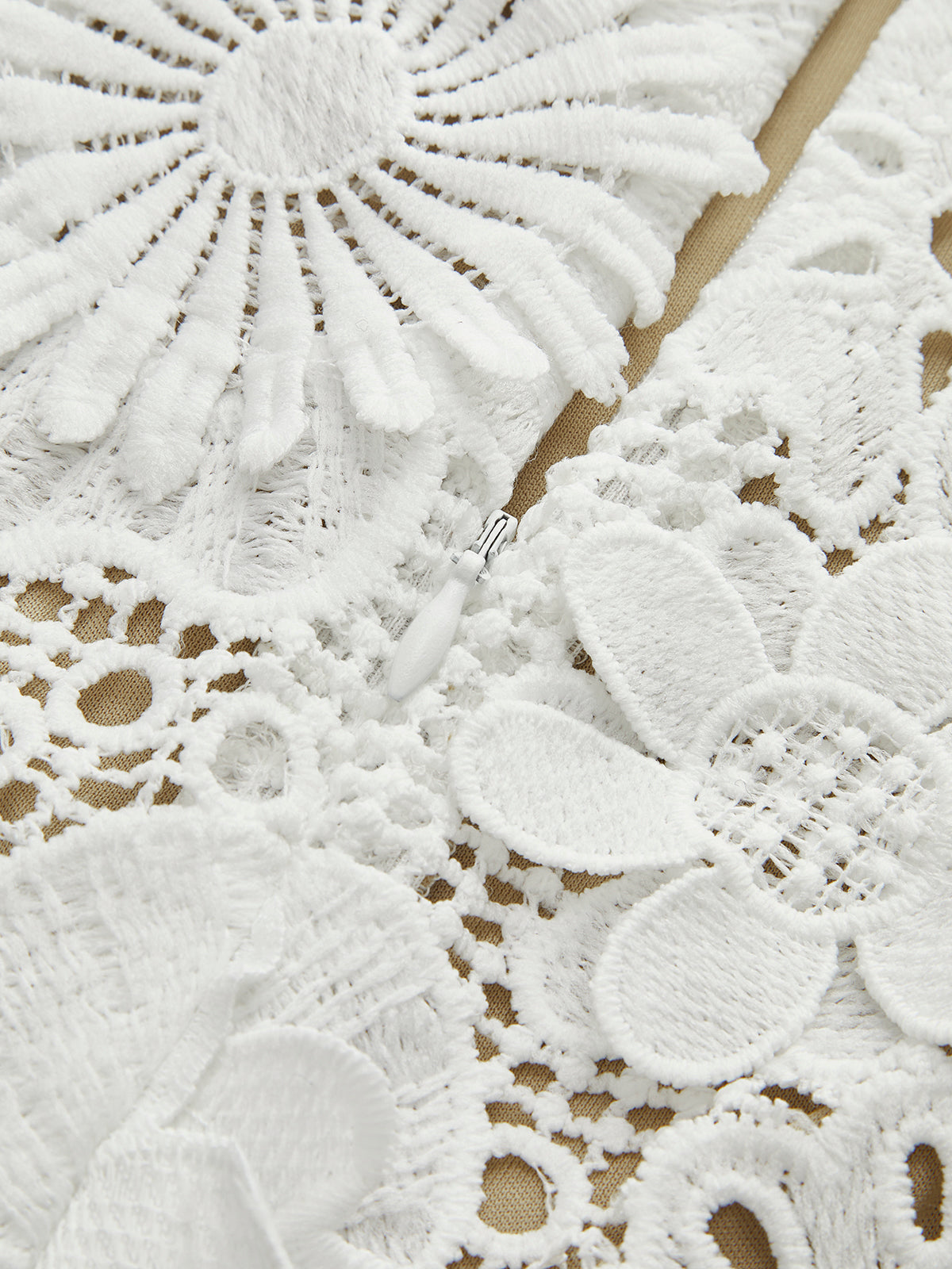 Close-up of white lace zipper detail
