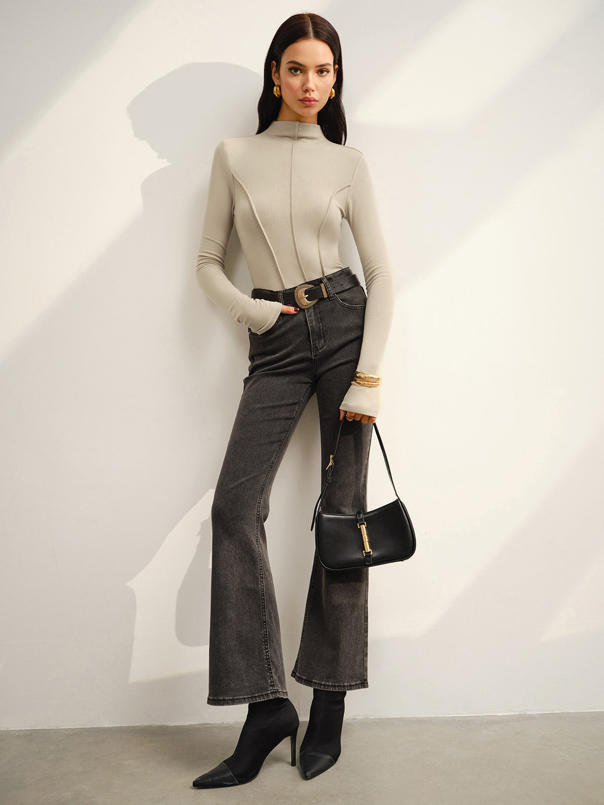 Khaki high-neck top with black belt and jeans full outfit