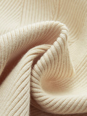 Close-up of cream ribbed knit fabric texture