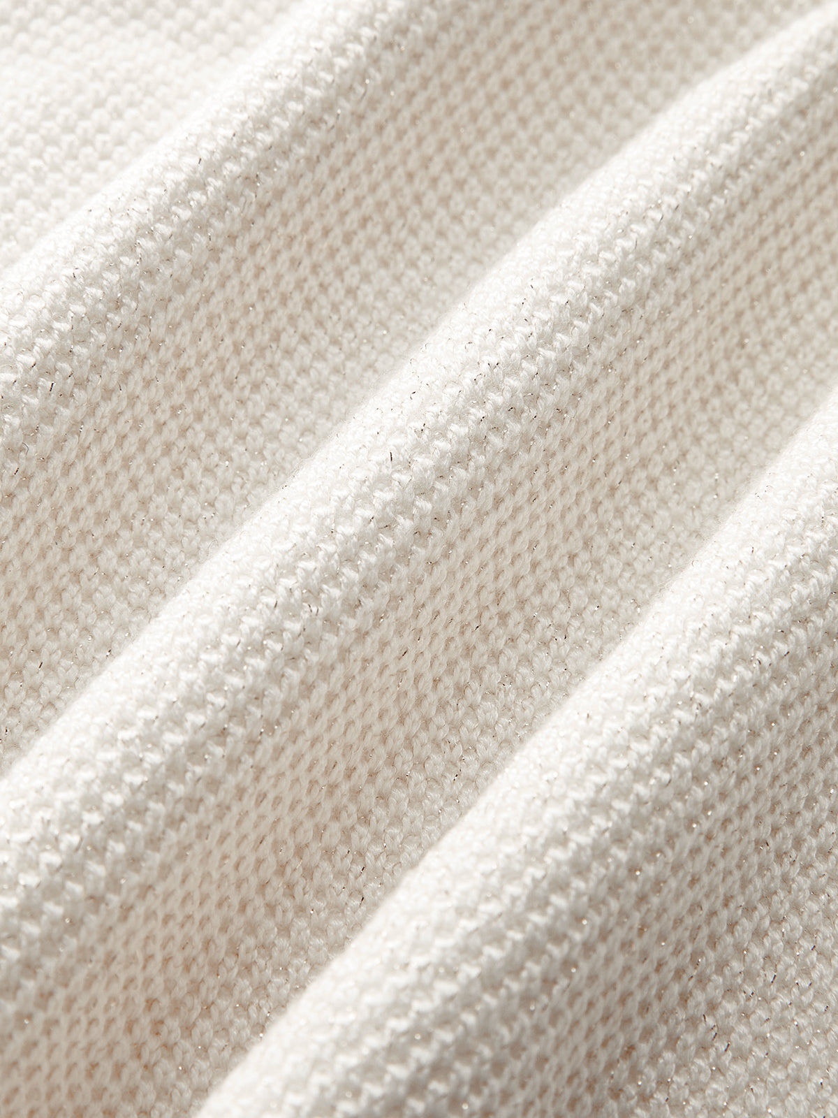 Cream vest fabric texture close-up