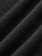 Black tank top with asymmetrical neckline fabric texture close-up
