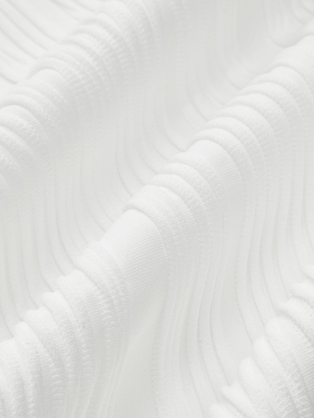 Close-up of white ribbed sleeveless top fabric texture