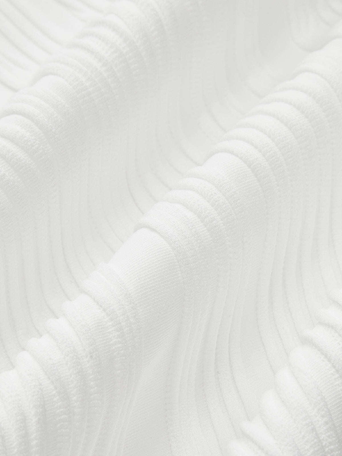 Close-up of white ribbed sleeveless top fabric texture