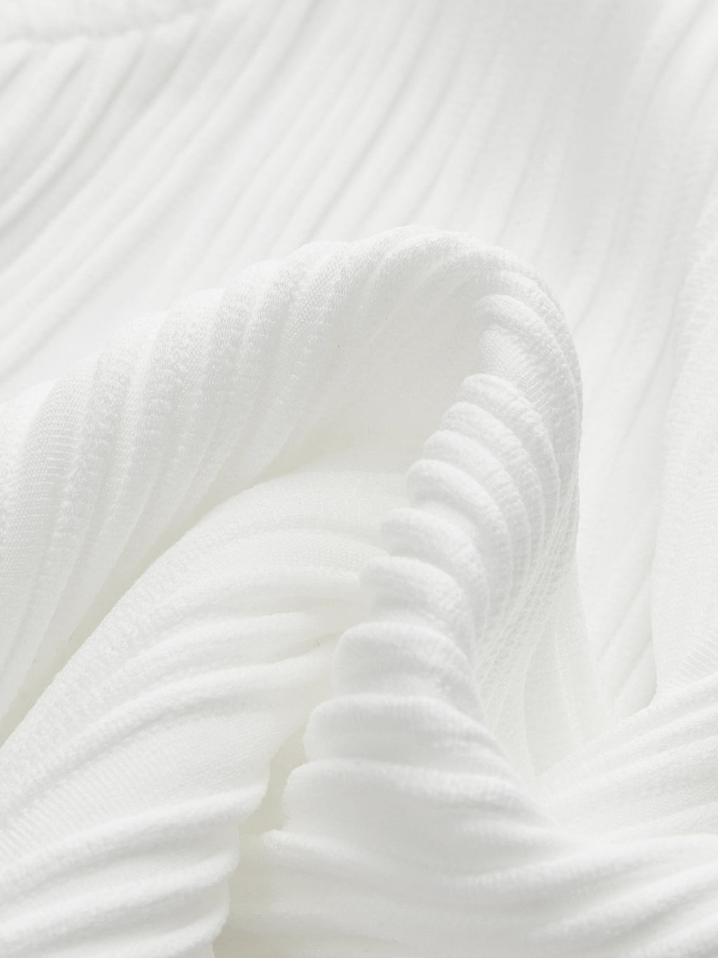 Close-up of white ribbed sleeveless top neckline detail