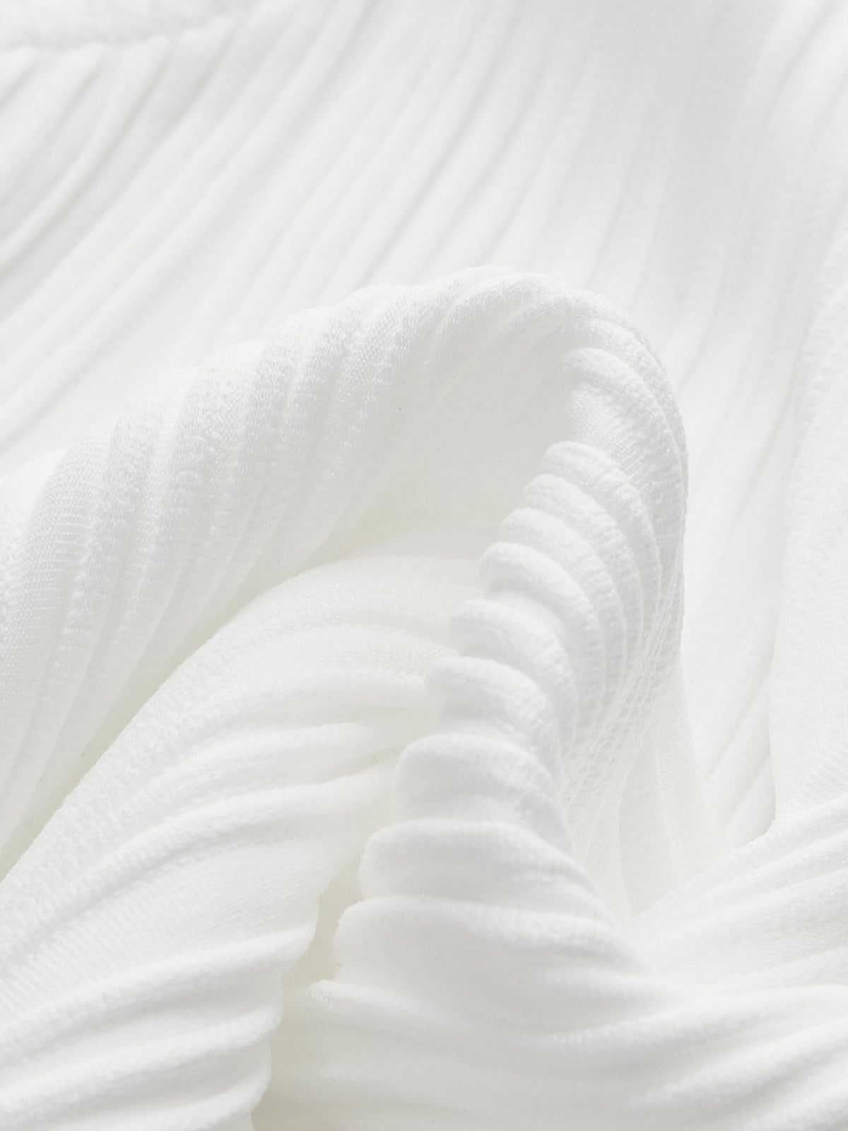 Close-up of white ribbed sleeveless top neckline detail