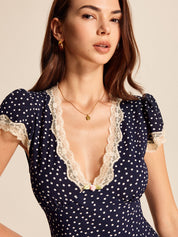 Midi dress navy blue with white polka dots and lace close-up detail