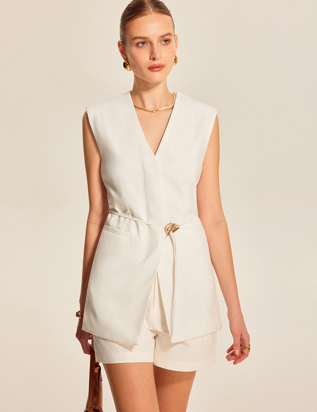 White sleeveless vest with belt front view