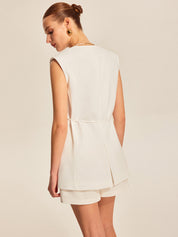 White sleeveless vest with belt back view