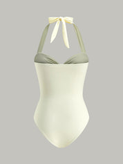 White one-piece swimsuit with gold detail studio back view