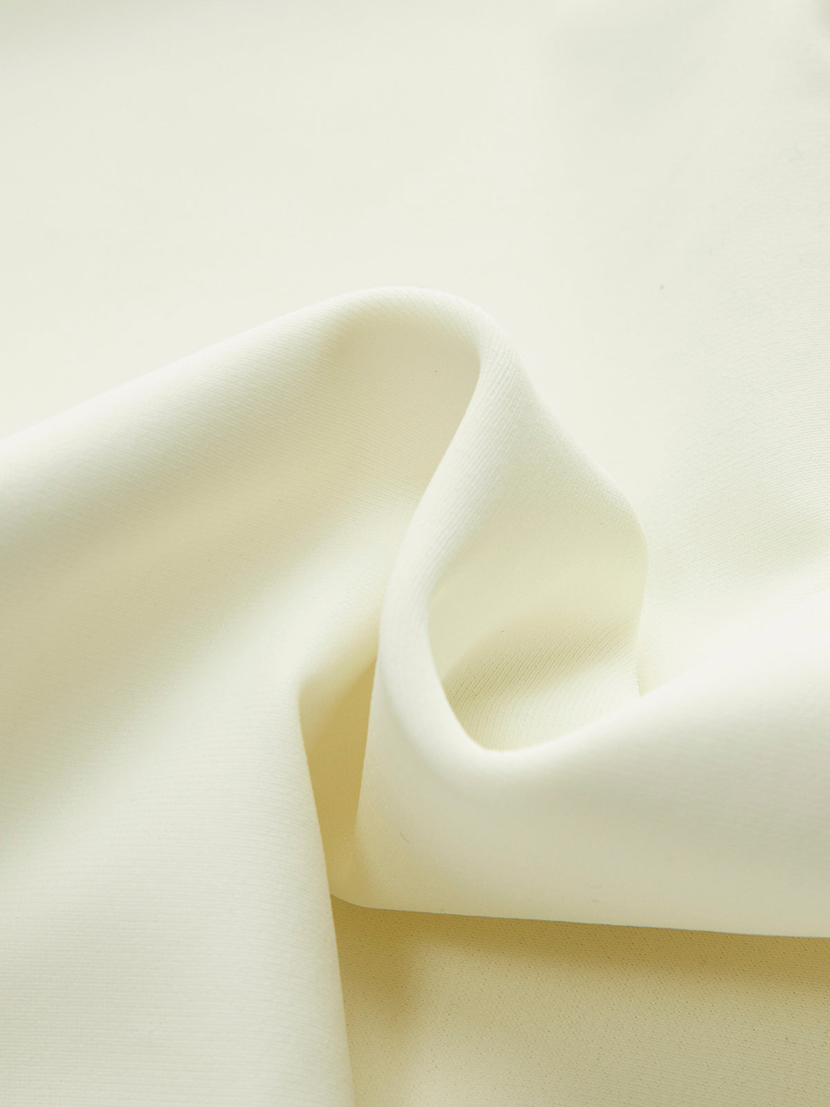 White one-piece swimsuit fabric texture close-up