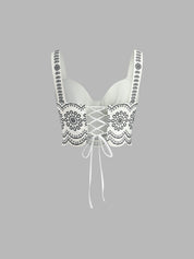 Top white with black floral embroidery side view