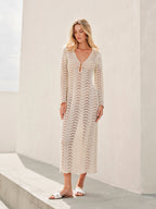 Cream lace dress with bell sleeves and white sandals full body view