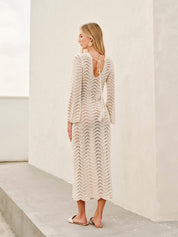 Cream lace dress with bell sleeves and tie back detail back view