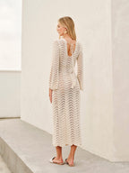 Cream lace dress with bell sleeves and tie back detail back view