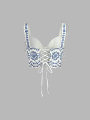 Top white with blue floral embroidery side view