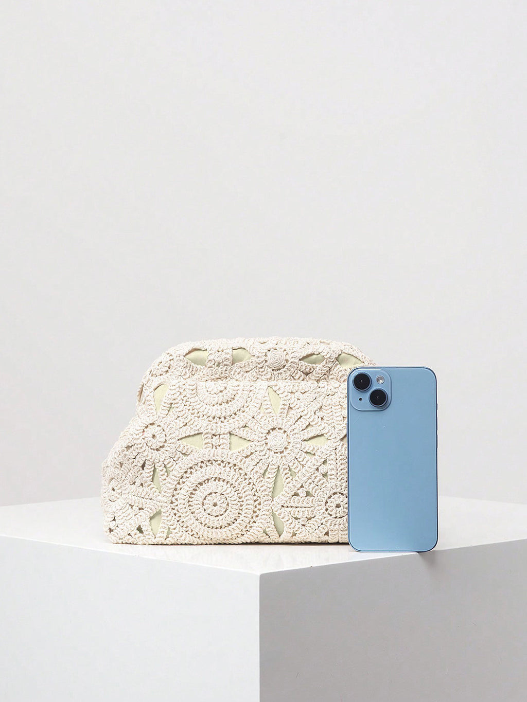 Crochet clutch bag white size comparison with phone