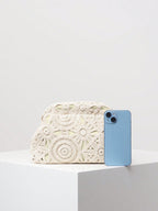 Crochet clutch bag white size comparison with phone