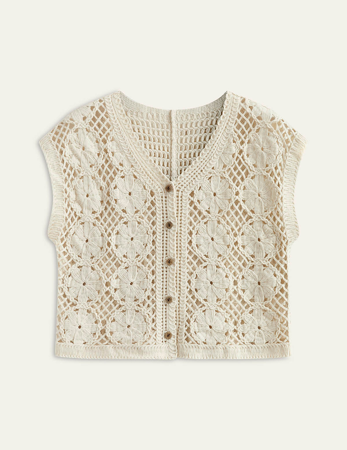 Cream crochet vest with floral pattern isolated view
