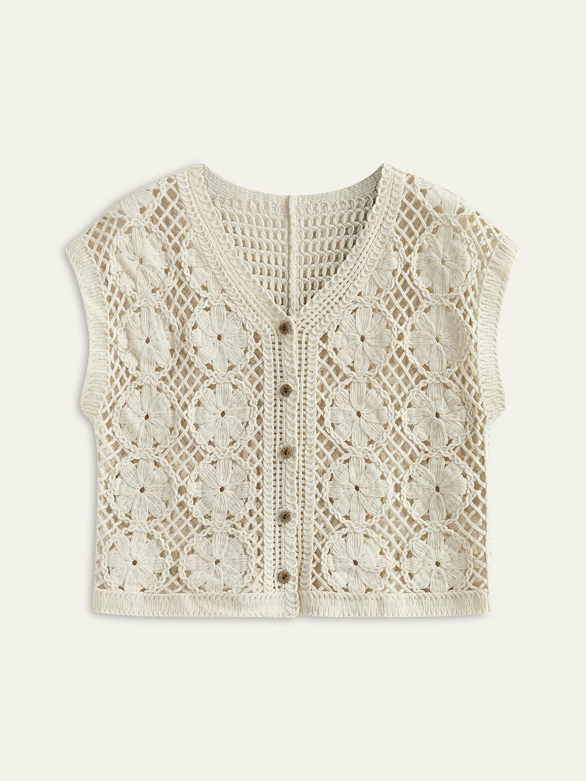 Cream crochet vest with floral pattern isolated view