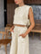 Beige two-piece set with crop top and wide-leg pants side view