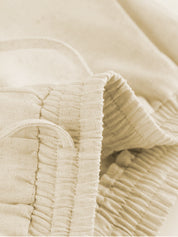 Beige two-piece set waistband detail close-up