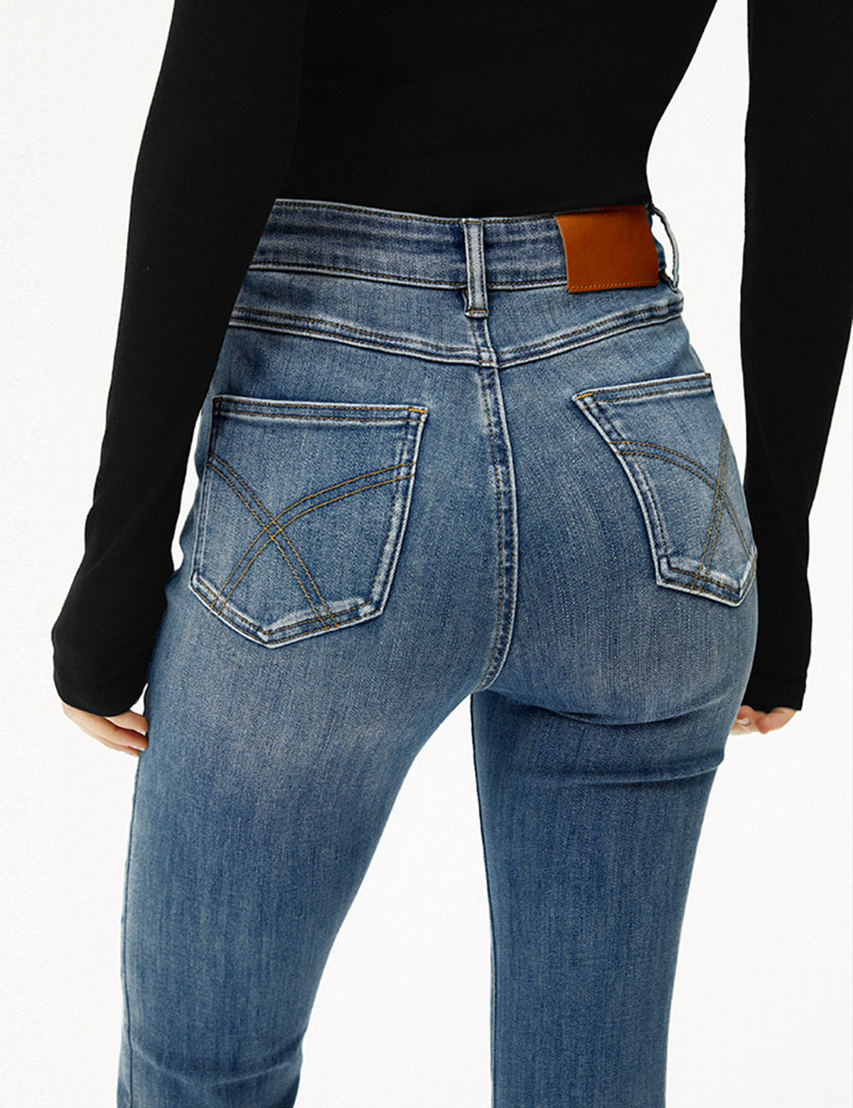 Blauwe jeans high-waist bootcut slim fit achterkant