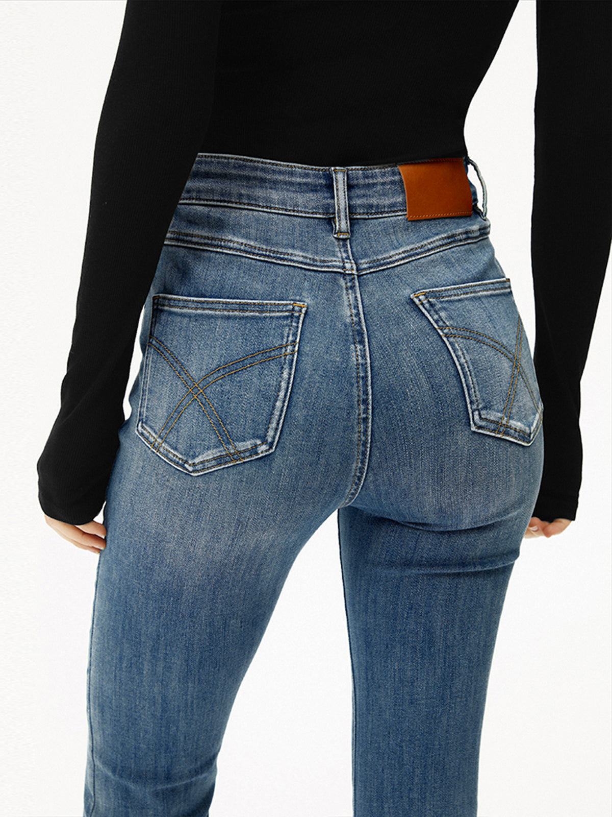 Blauwe jeans high-waist bootcut slim fit achterkant