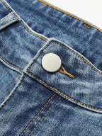 Blauwe jeans met gouden naad en zilveren knoop detail