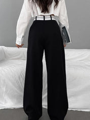 Wide-leg black pants with white waistband back view