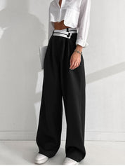 Black pants with white waistband and black buttons front view