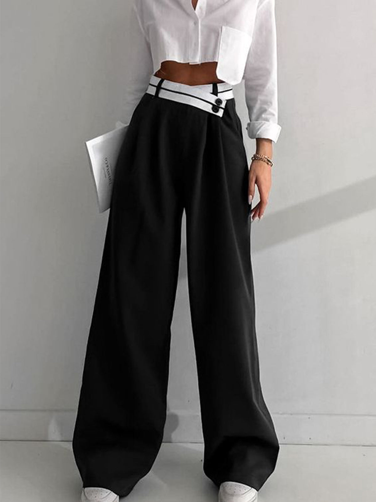 Wide-leg black pants with white contrast waistband front view