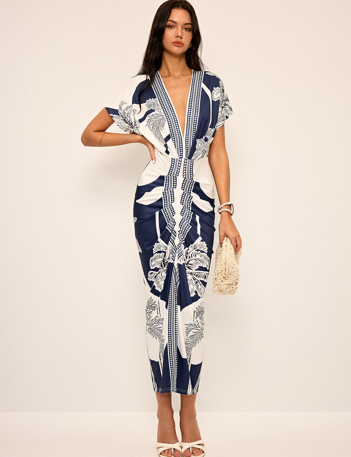 Dress with deep V-neck and tropical print, front view