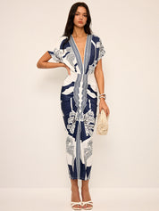 Dress with deep V-neck and tropical print, front view